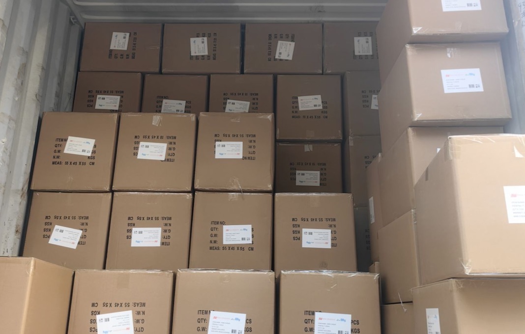 Labelled cartons stacked inside a container during loading